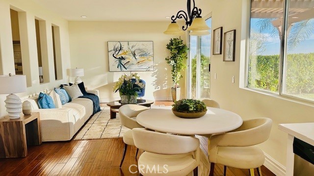 19900 Mariposa Creek Way Porter Ranch, CA 91326 - Photo 13 of 37 a dining room with furniture and wooden floor