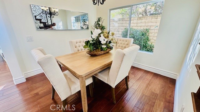 19900 Mariposa Creek Way Porter Ranch, CA 91326 - Photo 16 of 37 a view of a dining room with furniture and wooden floor
