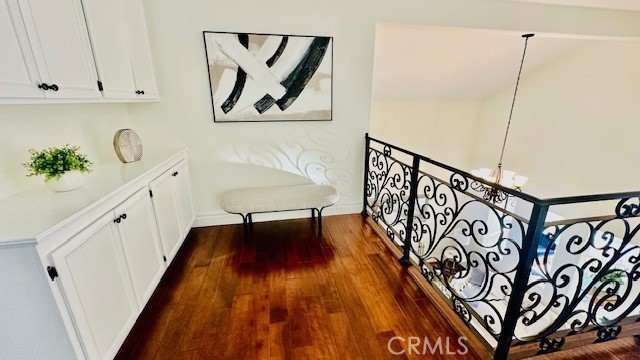 19900 Mariposa Creek Way Porter Ranch, CA 91326 - Photo 21 of 37 a hallway with painting on the wall and a window