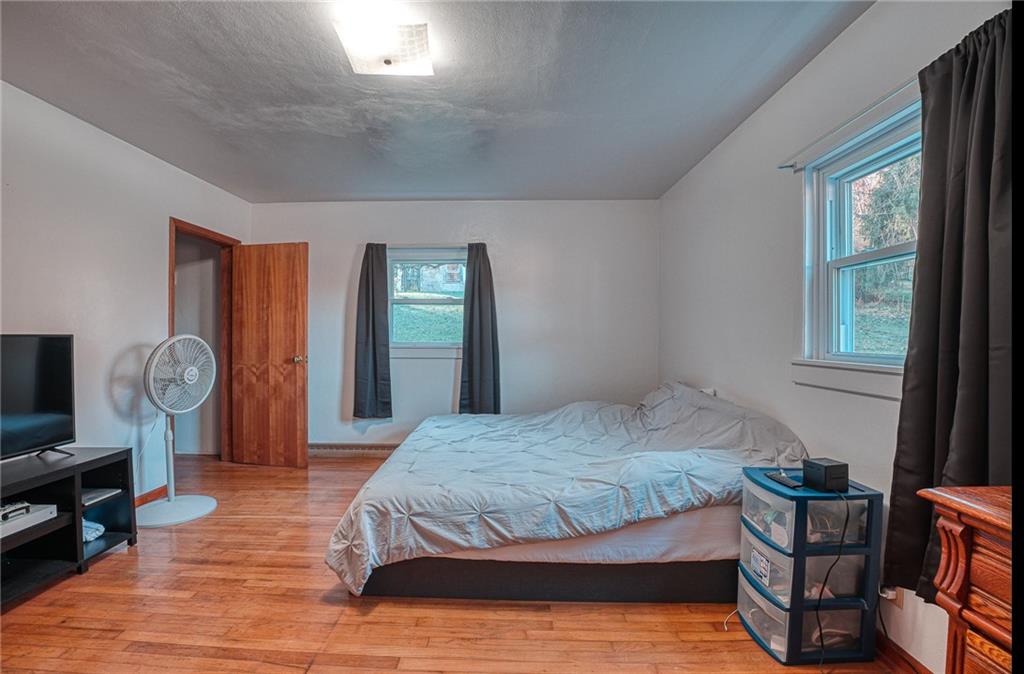 17 Goat Hill Road Joffre, PA 15019 - Photo 14 of 22 a bedroom with a bed and a tv on table