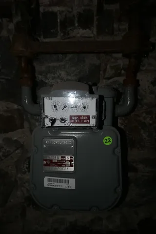 a view of a porch with a table and chairs