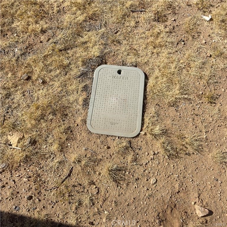 59787 Sharp Terrace Drive Yucca Valley, CA 92284 - Photo 17 of 19 a building with a dry view of it