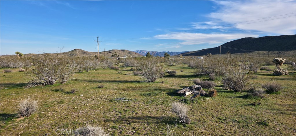 59787 Sharp Terrace Drive Yucca Valley, CA 92284 - Photo 8 of 19 a view of a town with mountains in the background