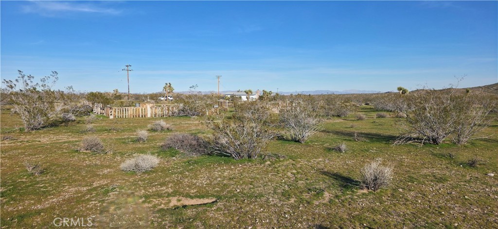 59787 Sharp Terrace Drive Yucca Valley, CA 92284 - Photo 10 of 19 a view of a town with mountains in the background