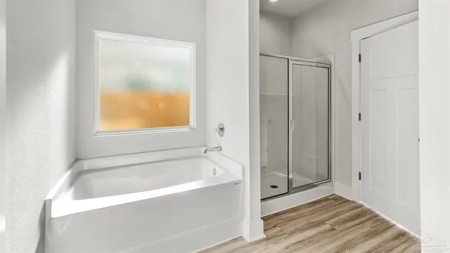 a bathroom with a bathtub and a shower