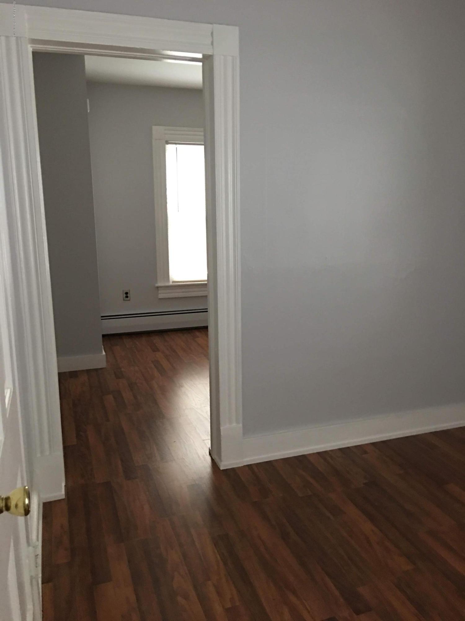 1519 Pine Street Scranton, PA 18510 - Photo 12 of 13 a view of empty room with wooden floor and fan