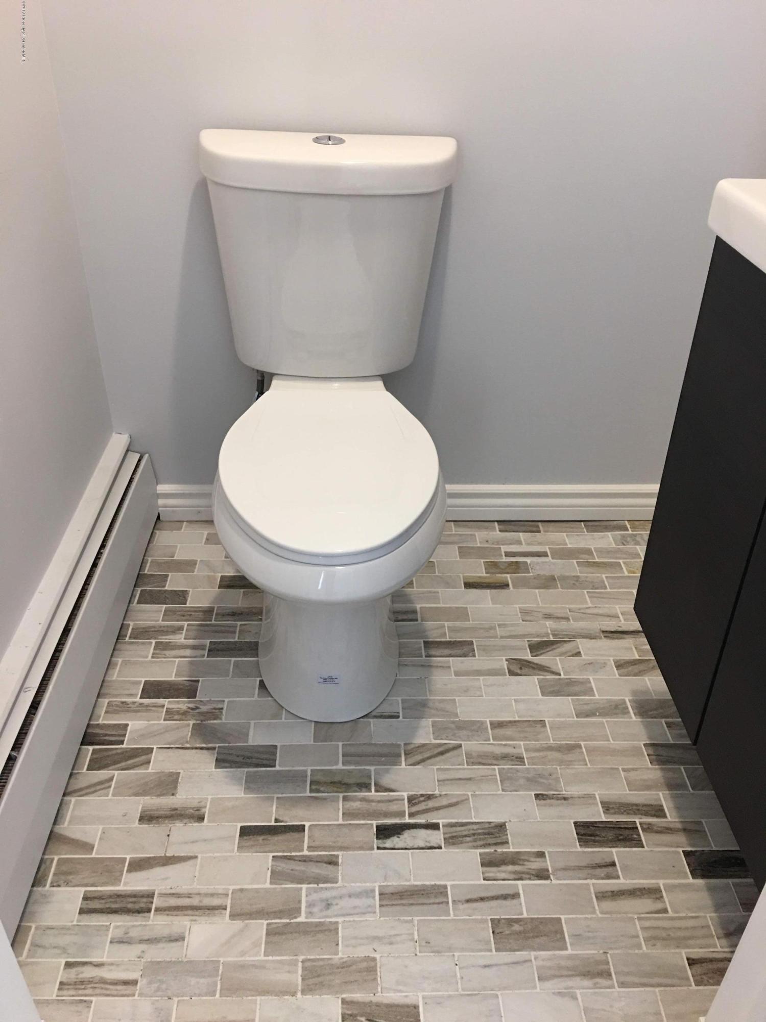 1519 Pine Street Scranton, PA 18510 - Photo 4 of 13 a white toilet sitting next to a shower