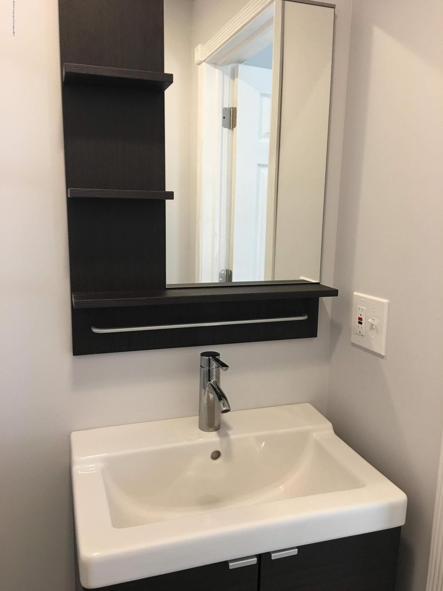 1519 Pine Street Scranton, PA 18510 - Photo 5 of 13 a bathroom with a sink and a mirror