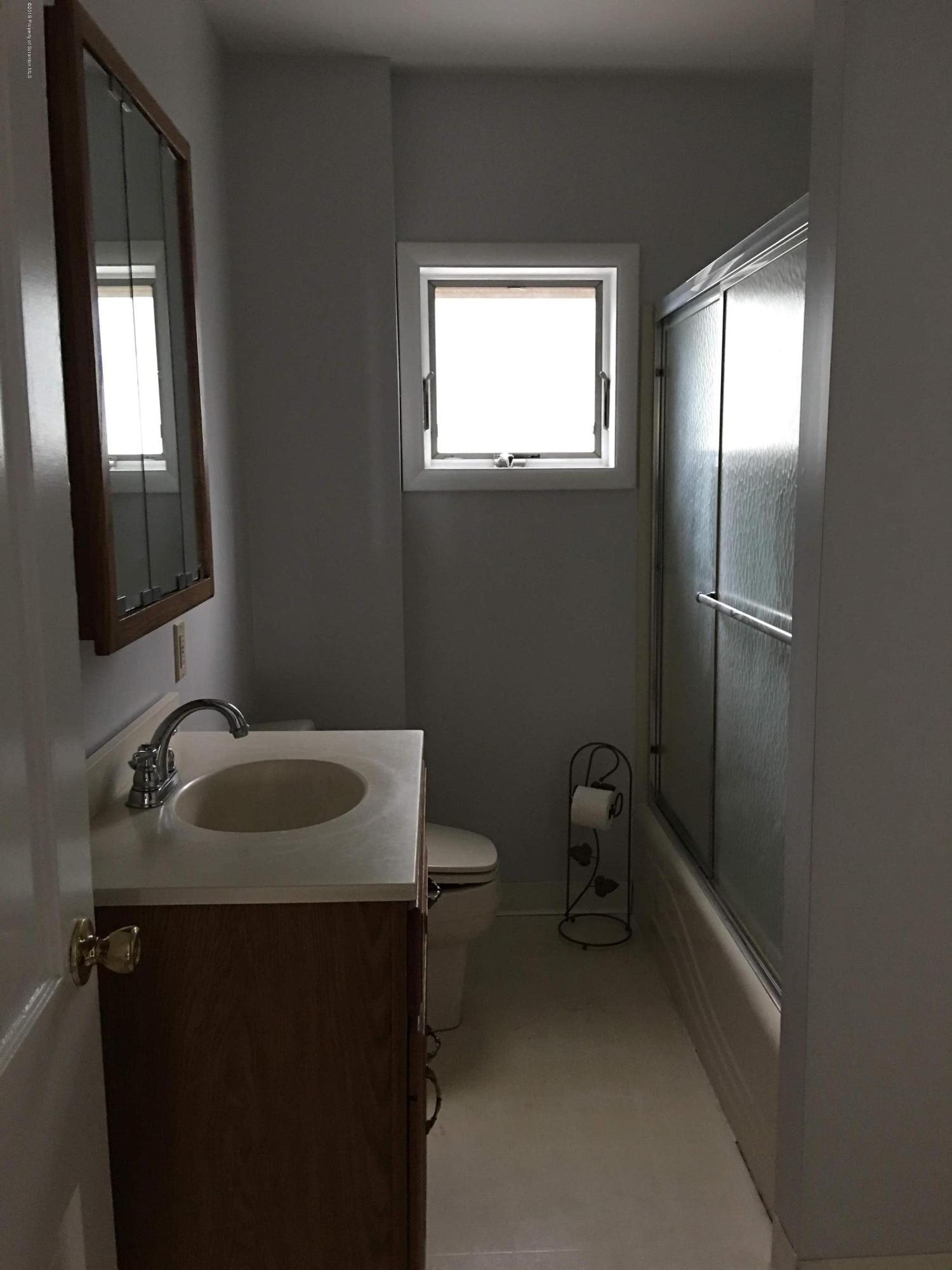 1519 Pine Street Scranton, PA 18510 - Photo 7 of 13 a bathroom with a sink toilet and mirror