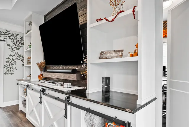 a kitchen with stainless steel appliances a refrigerator and a stove top oven