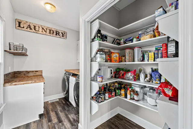 a view of a room with toys and a chandelier