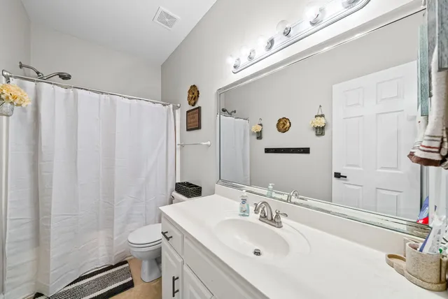 a view of a house with a backyard porch and sitting area