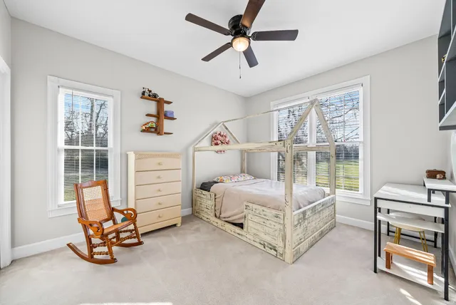 an aerial view of residential house with outdoor space and swimming pool