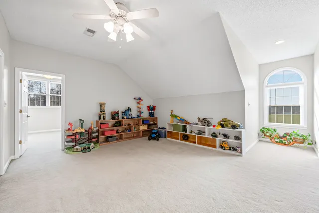 an aerial view of a residential houses with outdoor space and street view