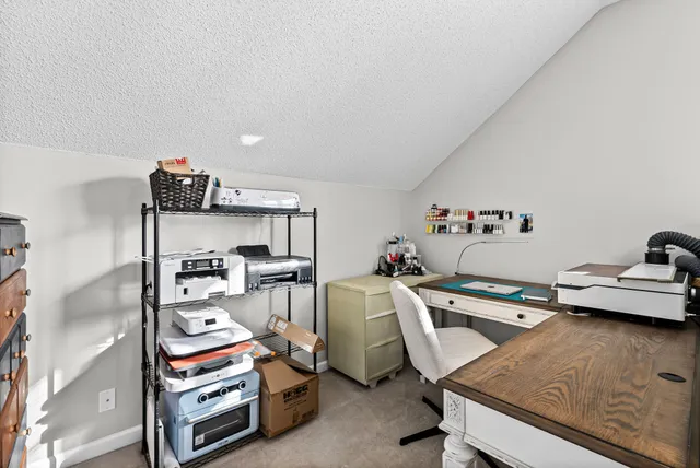 an aerial view of a golf course with parking space