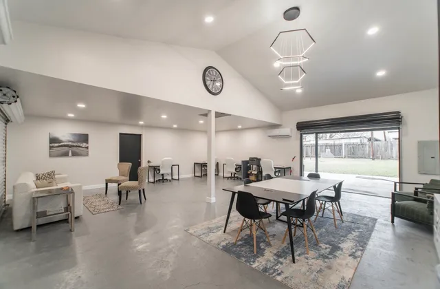 a view of a dining room with furniture window and outside view