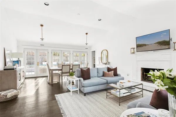 a living room with furniture fireplace and a flat screen tv