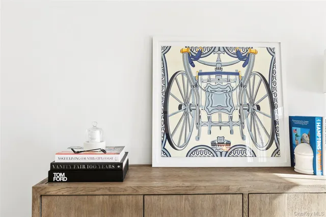 a living room with fireplace furniture and a large window