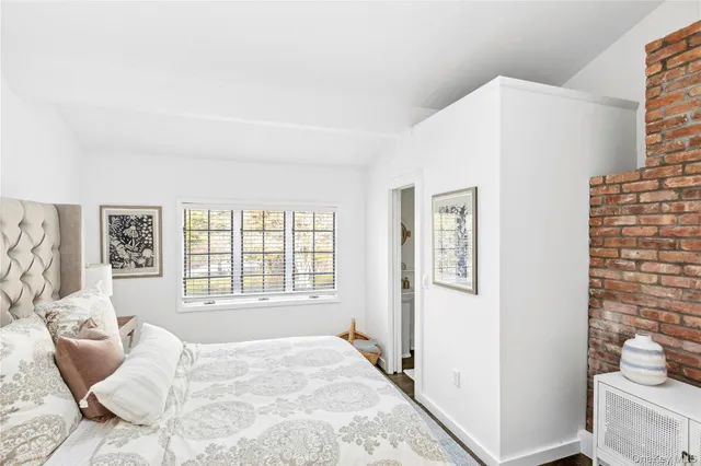 a bathroom with a sink a mirror and a toilet