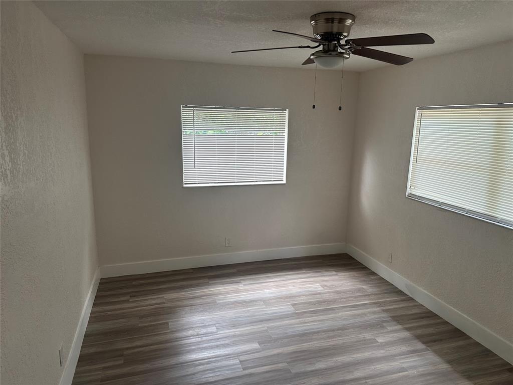 Margate Margate, FL 33068 - Photo 11 of 14 wooden floor in an empty room with a window