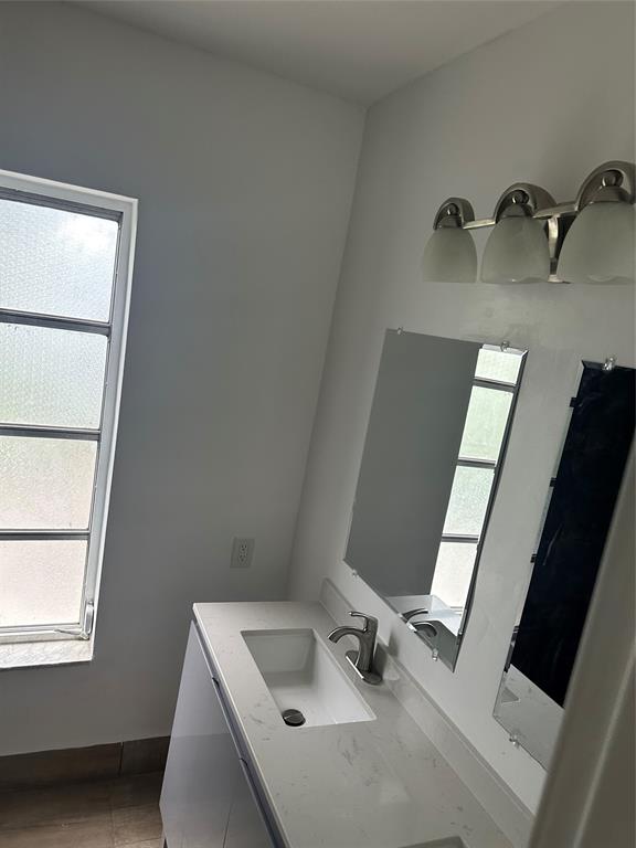 Margate Margate, FL 33068 - Photo 14 of 14 a bathroom with a sink and a mirror