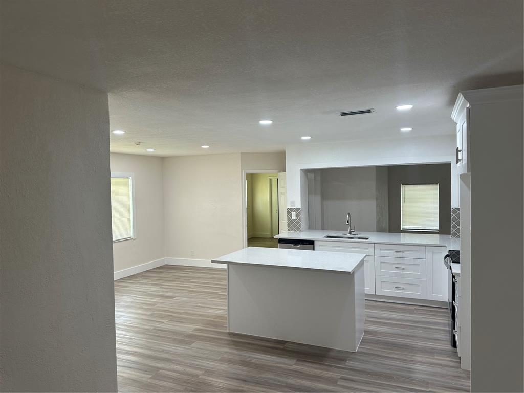 Margate Margate, FL 33068 - Photo 7 of 14 a view of a kitchen counter top space wooden cabinets and refrigerator