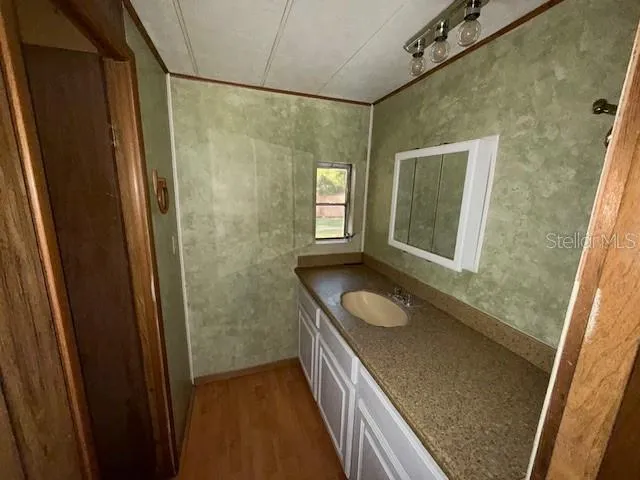 a bathroom with a toilet and shower