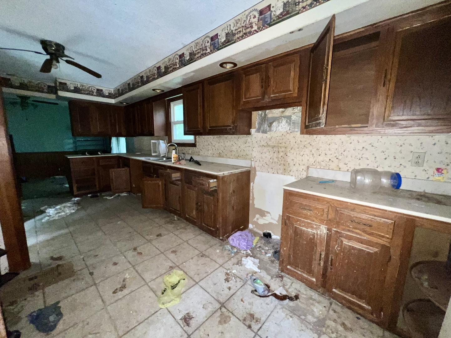 103 2nd Street Broadlands, IL 61816 - Photo 16 of 37 a kitchen with stainless steel appliances granite countertop a sink and cabinets