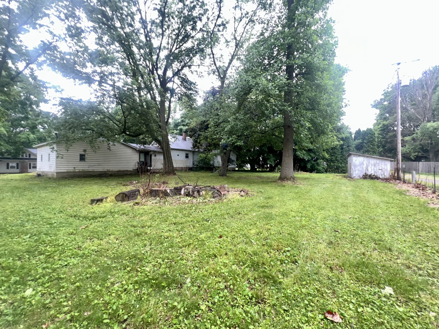 103 2nd Street Broadlands, IL 61816 - Photo 32 of 37 a view of a backyard with a garden and trees