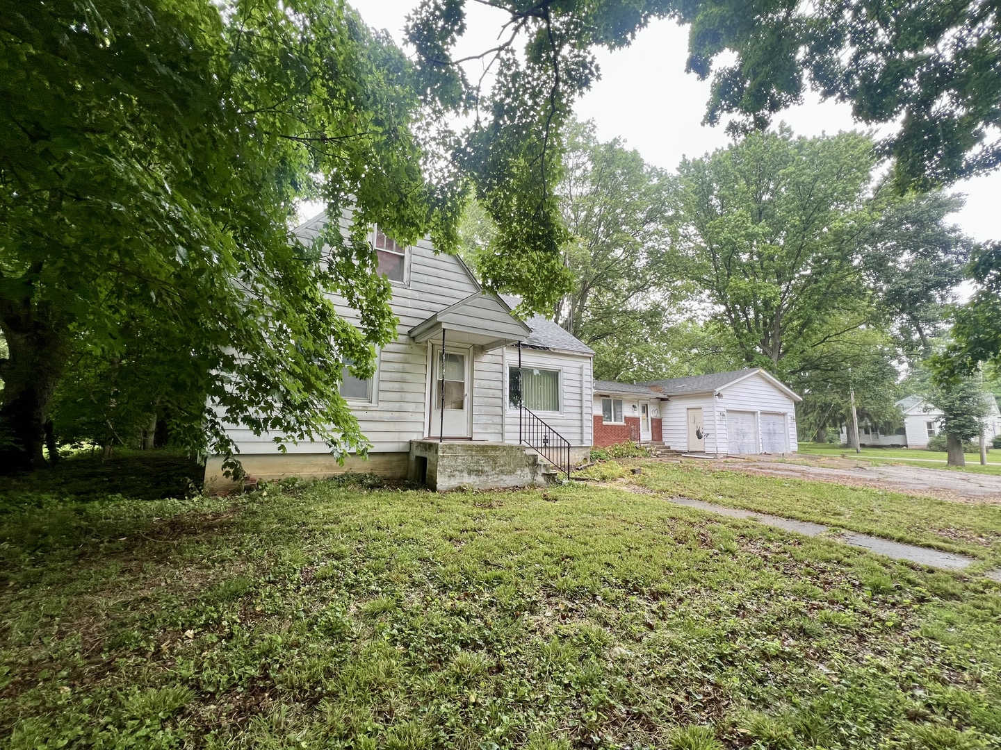 103 2nd Street Broadlands, IL 61816 - Photo 35 of 37 a house with green field in front of it