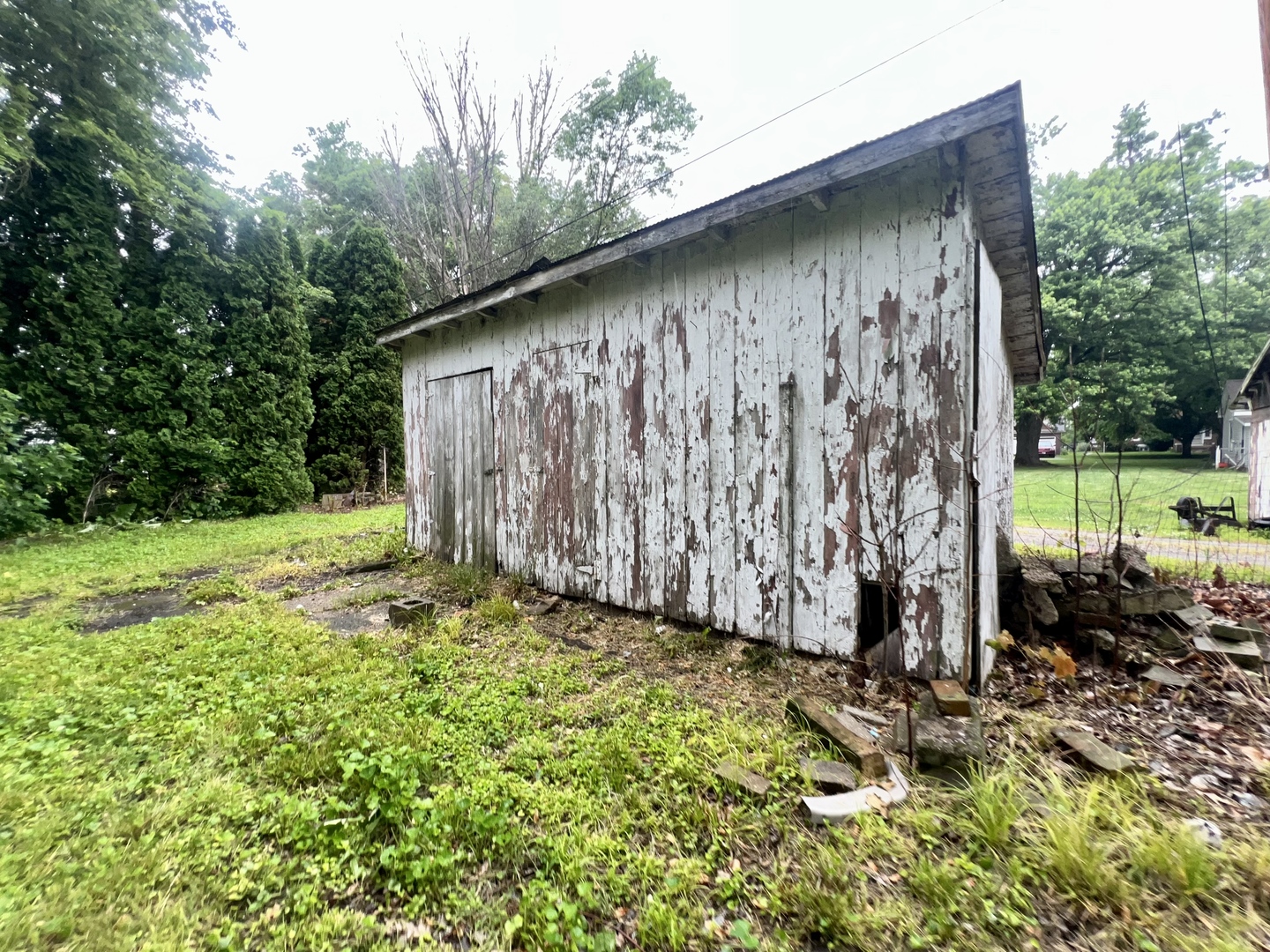 103 2nd Street Broadlands, IL 61816 - Photo 36 of 37 a backyard of a house with a yard and outdoor seating