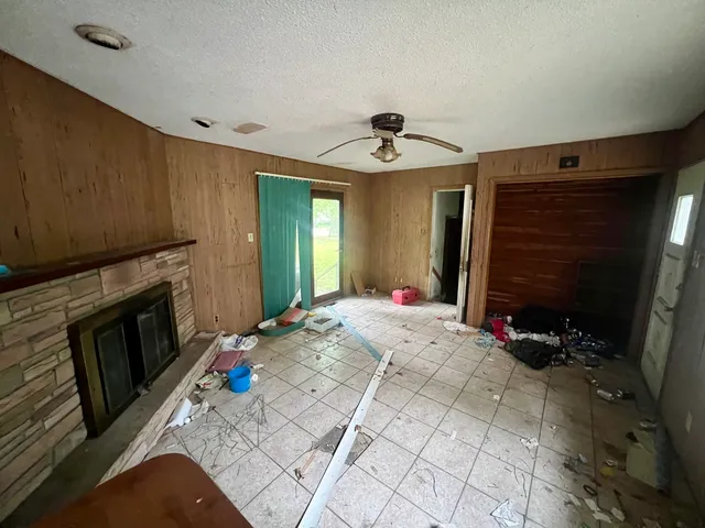 a bedroom with a bed and a television