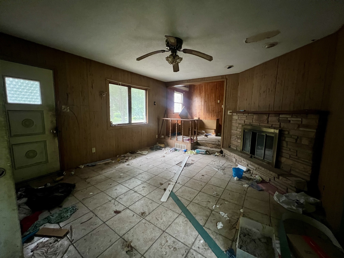103 2nd Street Broadlands, IL 61816 - Photo 5 of 37 a living room with furniture a window and a fireplace