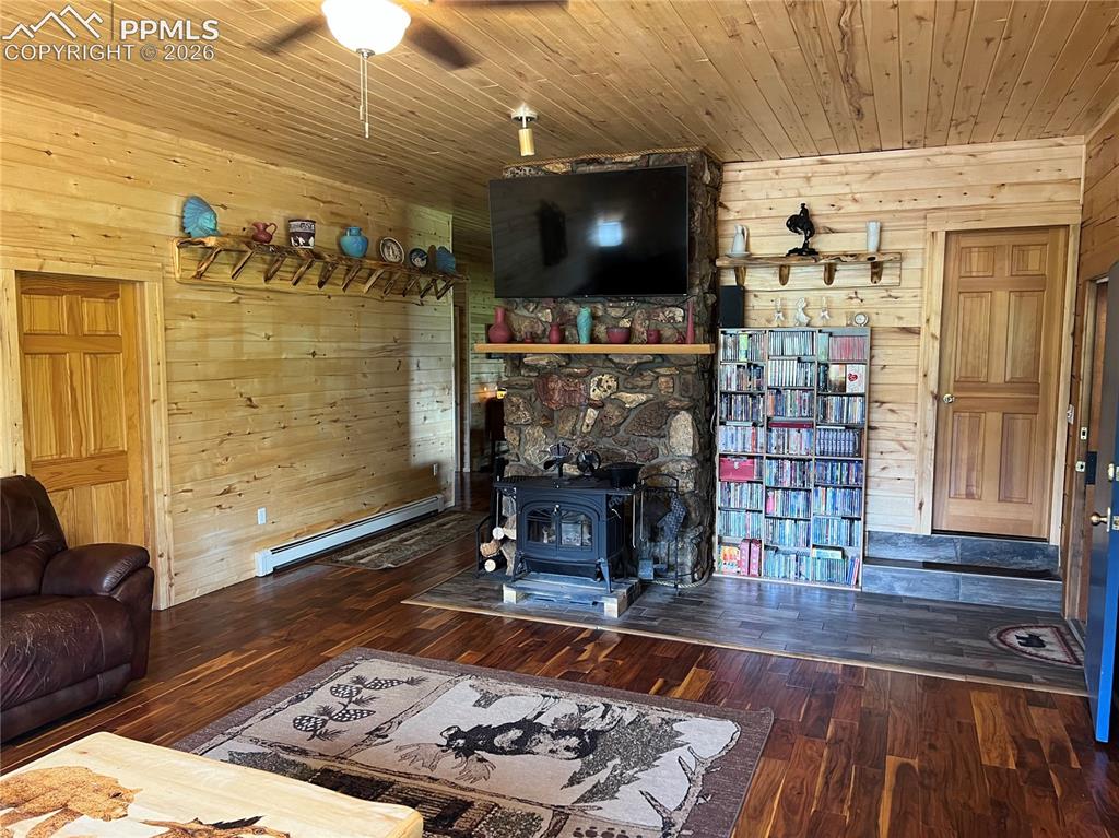 87 Thompson Road Gardner, CO 81040 - Photo 10 of 46 a living room with couch and a flat screen tv