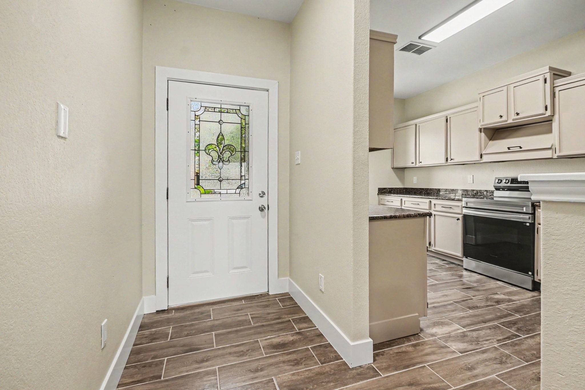 1322 Diamond Drape Drive Rosharon, TX 77583 - Photo 13 of 45 a kitchen with stainless steel appliances granite countertop a stove a sink and a refrigerator