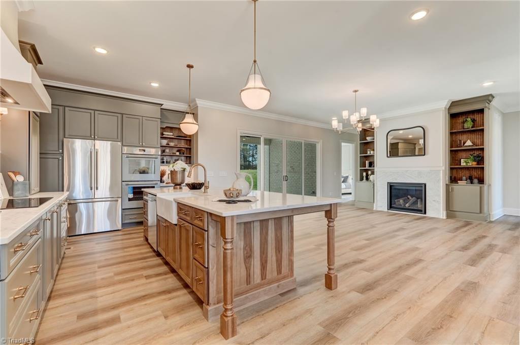 6806 Brennan Way Oak Ridge, NC 27310 - Photo 14 of 50 opposite view of kitchen into great room