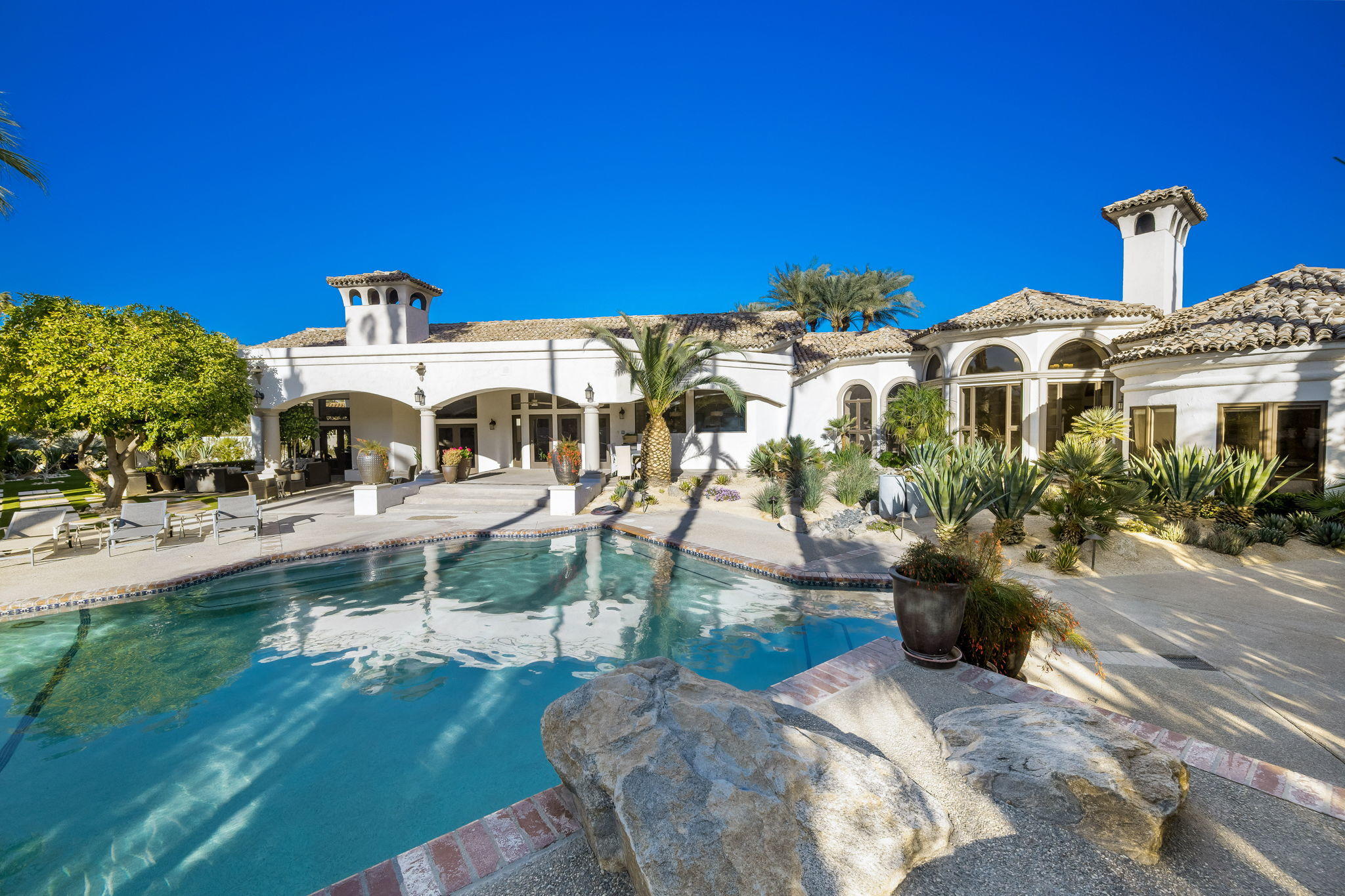 40475 Morningstar Road Rancho Mirage, CA 92270 - Photo 1 of 94 a front view of a house with a yard
