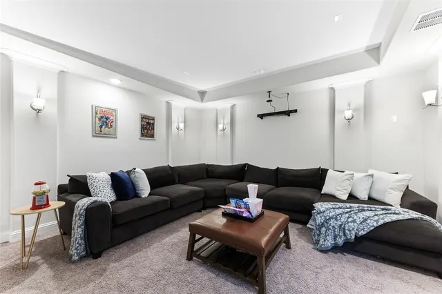 a living room with furniture and a rug