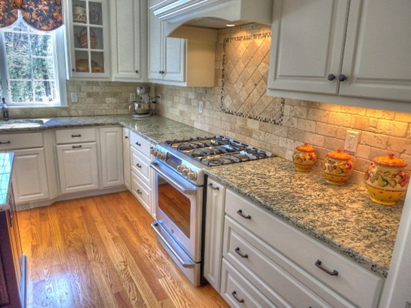 73 Front Street Hopkinton, MA 01748 - Photo 12 of 30 a kitchen with stainless steel appliances granite countertop a sink stove and cabinets
