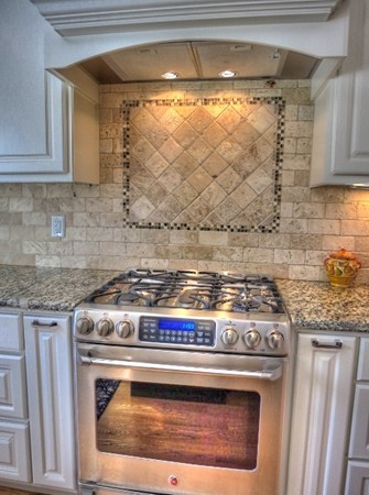 73 Front Street Hopkinton, MA 01748 - Photo 13 of 30 a stove top oven sitting inside of a kitchen