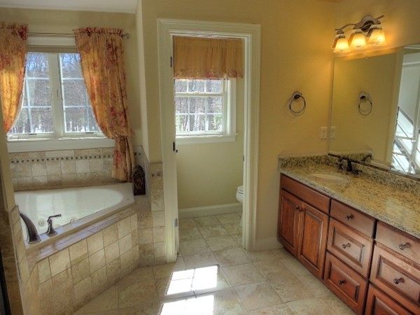 73 Front Street Hopkinton, MA 01748 - Photo 19 of 30 a bathroom with a sink and a mirror