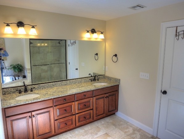 73 Front Street Hopkinton, MA 01748 - Photo 21 of 30 a bathroom with a granite countertop double vanity sink and a mirror