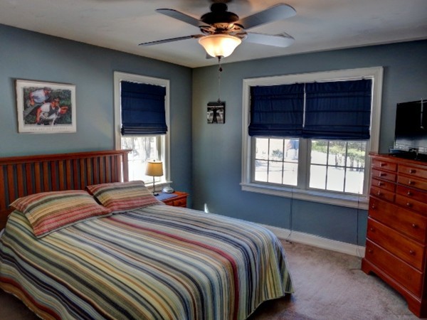 73 Front Street Hopkinton, MA 01748 - Photo 24 of 30 a bedroom with a bed and a flat screen tv