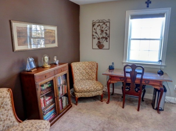73 Front Street Hopkinton, MA 01748 - Photo 26 of 30 a living room with furniture and a baby crib