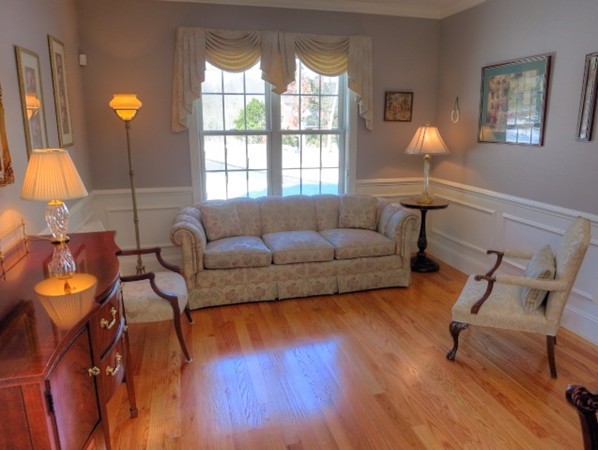 73 Front Street Hopkinton, MA 01748 - Photo 6 of 30 a living room with furniture and a lamp