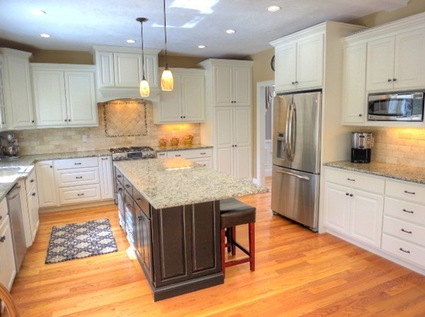 73 Front Street Hopkinton, MA 01748 - Photo 10 of 30 a kitchen with stainless steel appliances granite countertop a refrigerator a sink dishwasher a stove and white cabinets with wooden floor