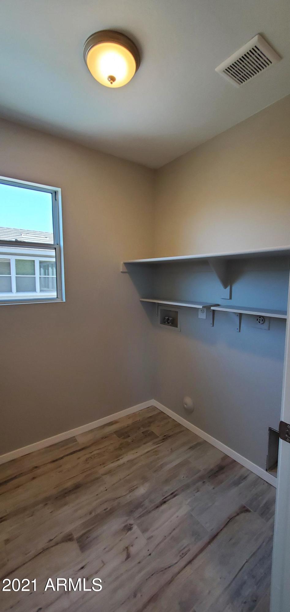 4218 West Carter Road Phoenix, AZ 85041 - Photo 18 of 26 Upstairs laundry room