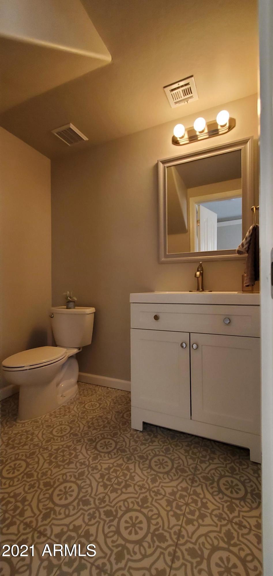 4218 West Carter Road Phoenix, AZ 85041 - Photo 6 of 26 Downstairs half bath