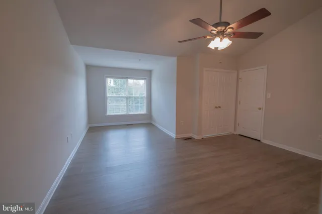 a bathroom with bathtub a shower and a window