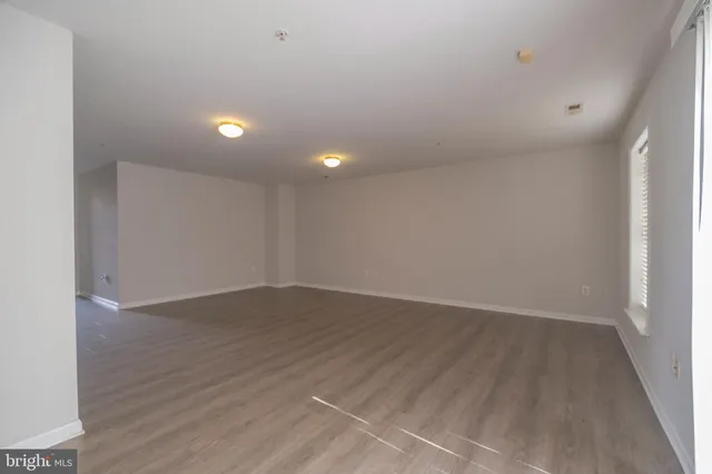 a view of a park with slide and a bench